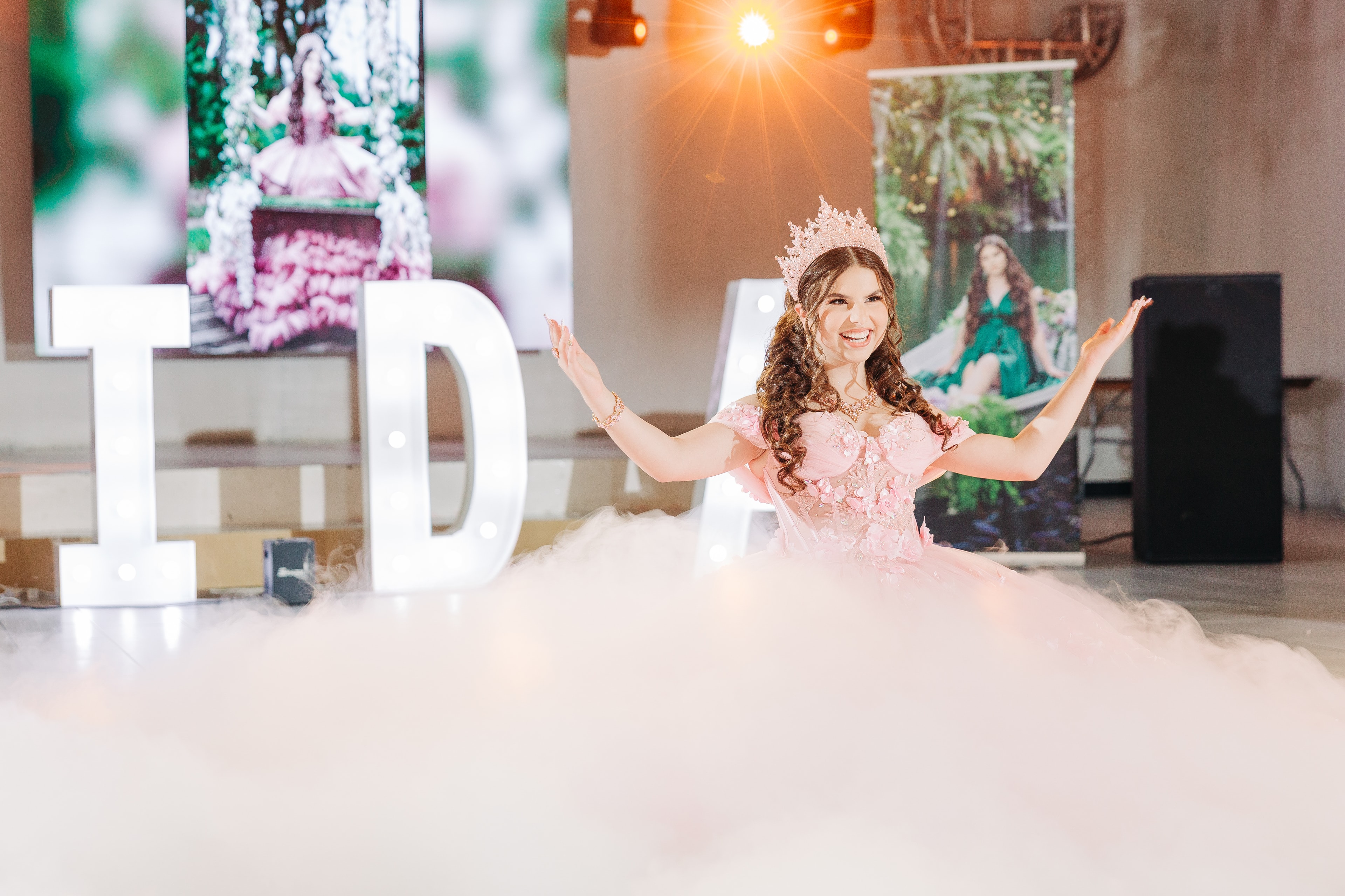 Quinceañera celebration moment — the 15-year-old in her custom gown during the first waltz with her father, a candid dance floor moment with friends, or a multi-generational family embrace during the traditions